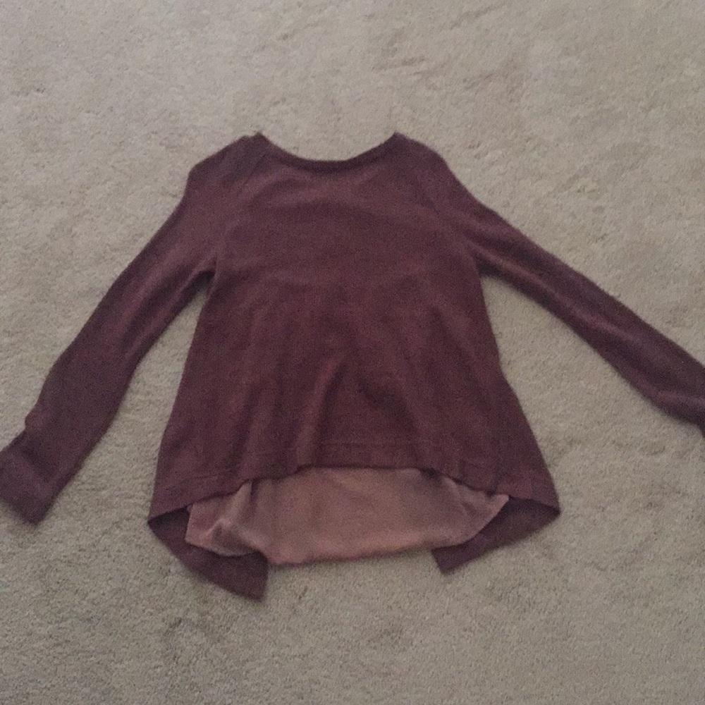Unique sweater with a surprise back.